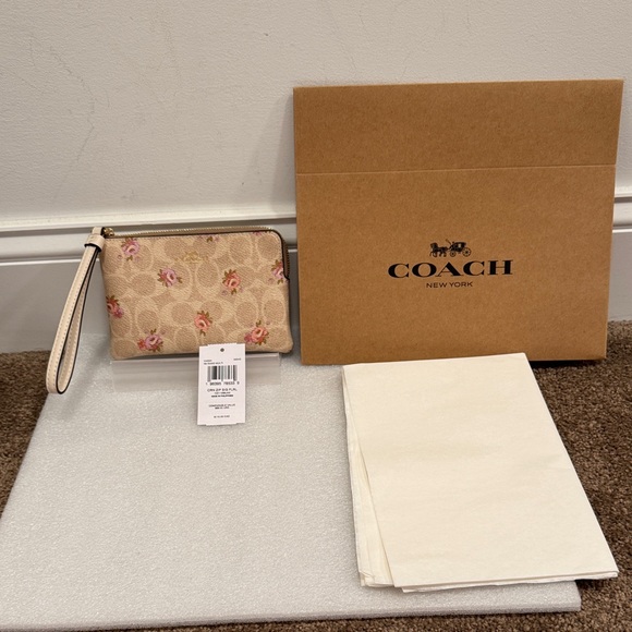 Coach Handbags - Coach Beige Floral Wristlet